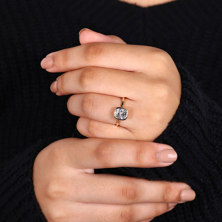IGI certified bezel set engagement ring with a stunning cushion diamond.