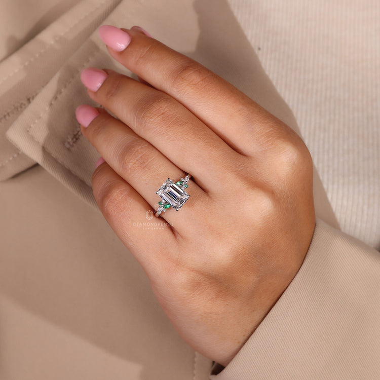 Stunning Marquise and Round Diamond Side Stones accentuate the beauty of the center diamond.