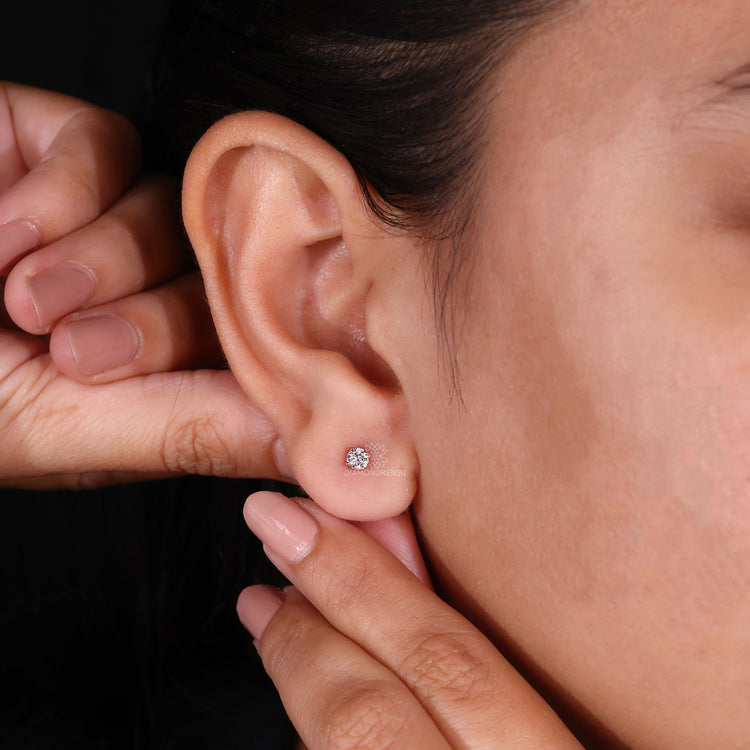 Classic round diamond stud earrings in an IGI certified design.