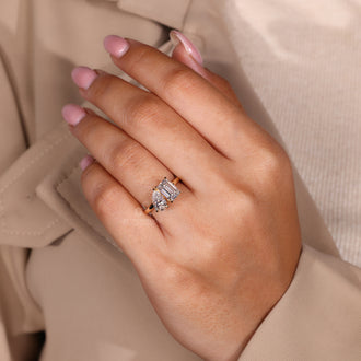 Claw prong setting on custom diamond ring in yellow gold.