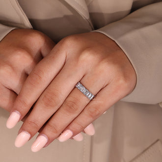 Custom diamond band with emerald cut style.