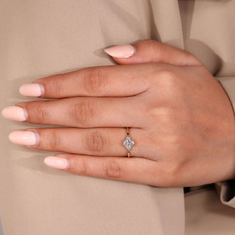 Custom diamond ring with oval diamond and handmade jewelry design.