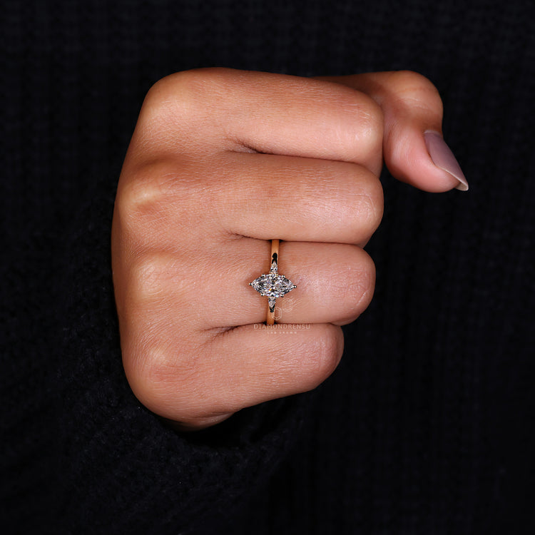 Three Stone Engagement Ring featuring a marquise diamond center.