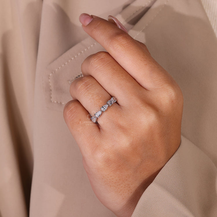 Handmade pear wedding band with a delicate setting.