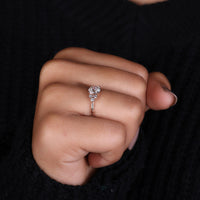 A round brilliant cut diamond shining brightly in a sleek setting.