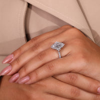 Elegant gold ring white with a dazzling marquise cut diamond.