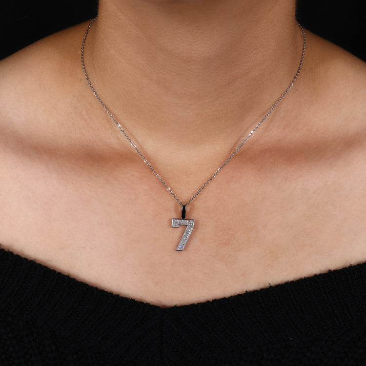 Custom round diamond hip hop pendant with white gold prong setting.