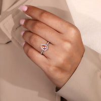 White gold pear halo diamond engagement ring.