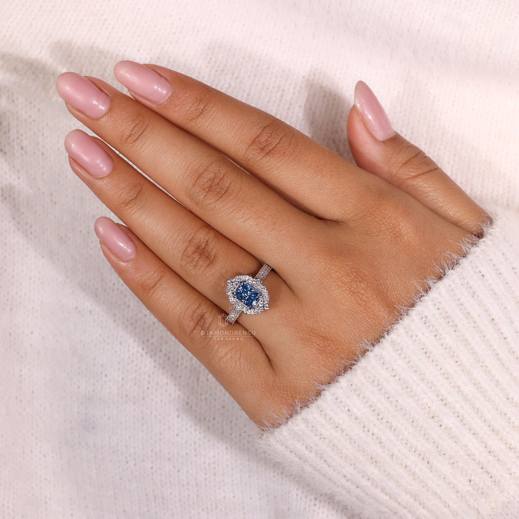 White gold ring with radiant cut blue diamond