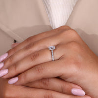 Round cut engagement ring featuring an emerald cut center stone for contrast.