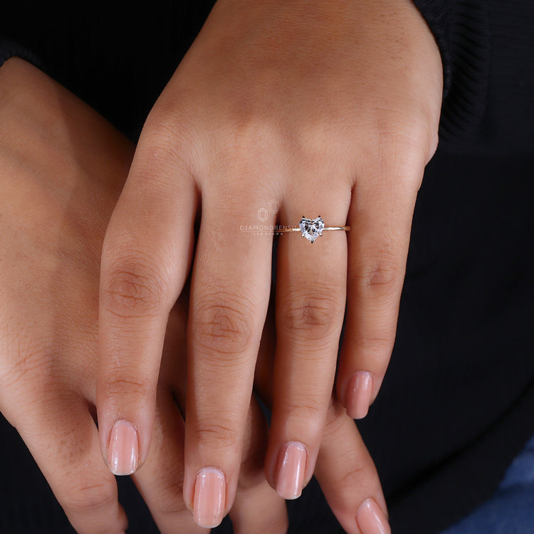 Heart shaped solitaire ring in a claw prong setting.