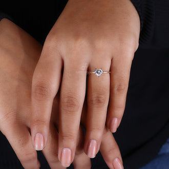 Heart shaped solitaire ring in a claw prong setting.