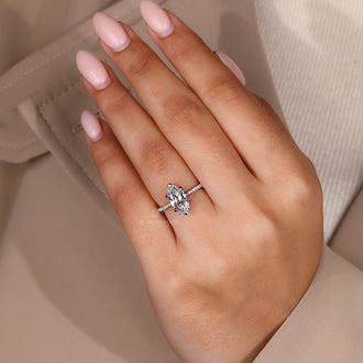 Custom marquise cut engagement ring with pave band.