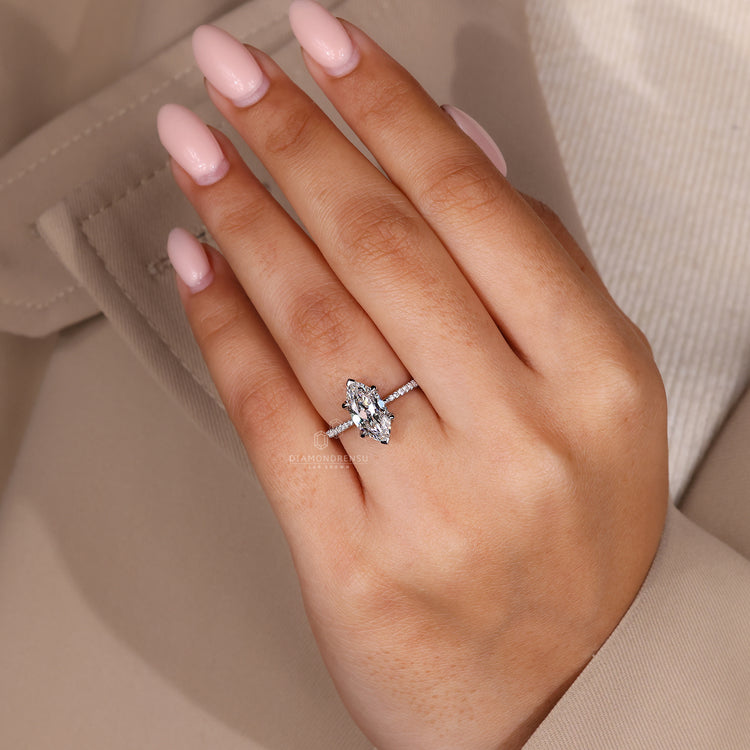 Custom marquise cut engagement ring with pave band.