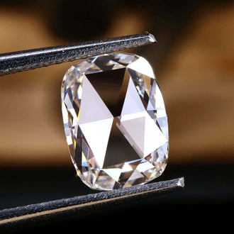 This 1.48 carat diamond has a delicate elongated cushion rose cut design.
