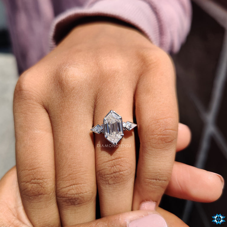 Elegant three-stone bezel set moissanite ring