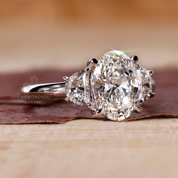 A four-claw prong setting holding an oval diamond