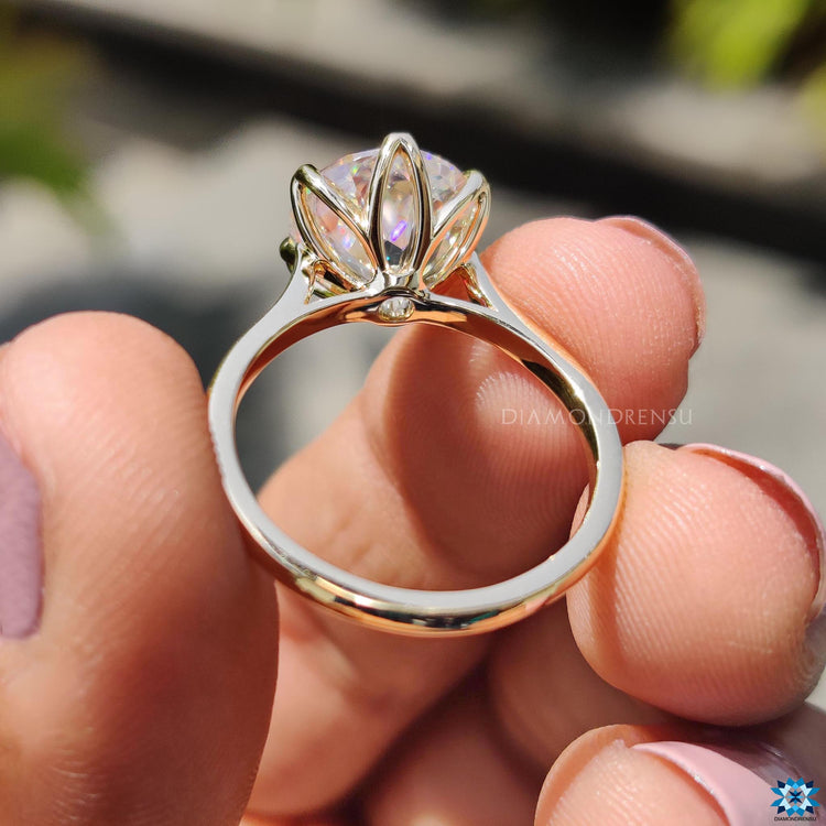 V-shaped prong setting on a moissanite ring.