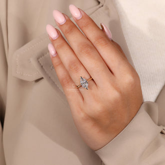 Lab Grown Diamond Engagement Ring featuring a round diamond in a cathedral setting.