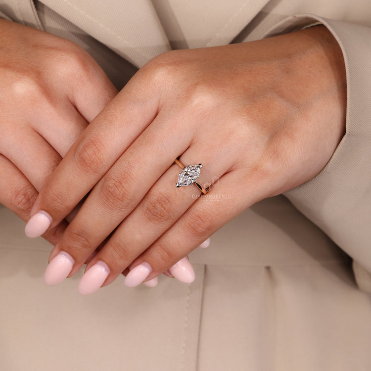 Cathedral Setting Ring with a stunning Dutch Marquise cut diamond and hidden halo details.