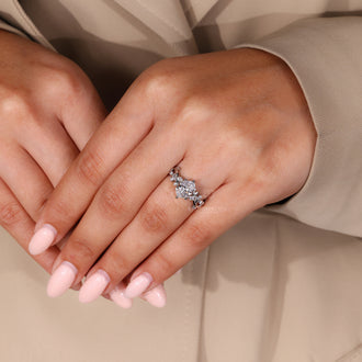 White gold engagement ring with nature-inspired structure.