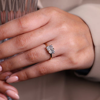 Handmade jewelry featuring a Toi Et Moi diamond ring design with radiant and pear cuts.