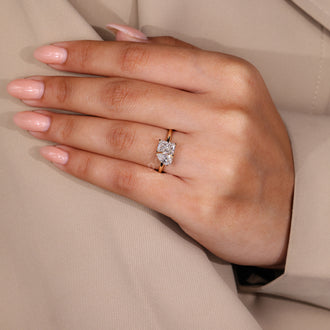 Buy engagement ring in yellow gold with radiant cut and pear cut diamonds.