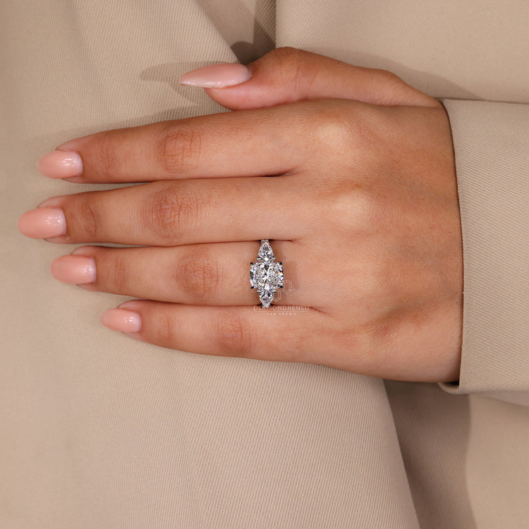 Handmade ring with a round diamond pave band and cushion center.