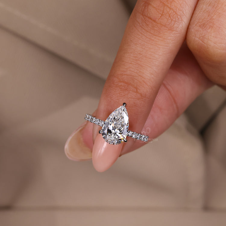 Handmade pear diamond engagement ring with lab grown center stone.