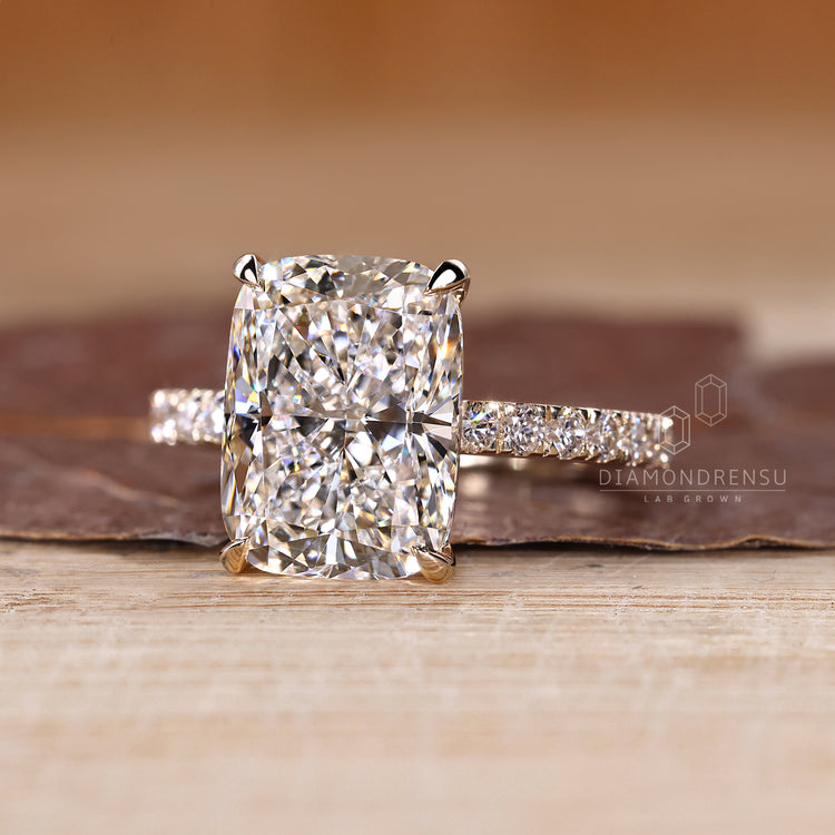 Buy engagement ring with elongated cushion and round cut pave band style.
