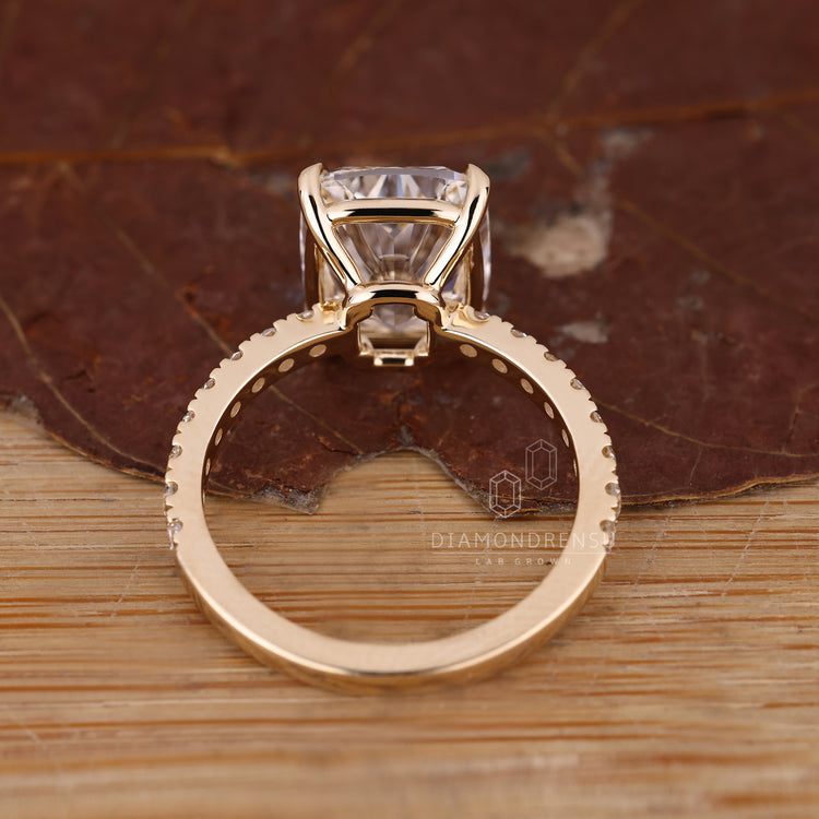 Pave setting ring on elongated cushion diamond available in every metal.