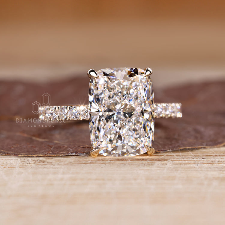 Handmade ring with elongated cushion and 4 claw prong setting.