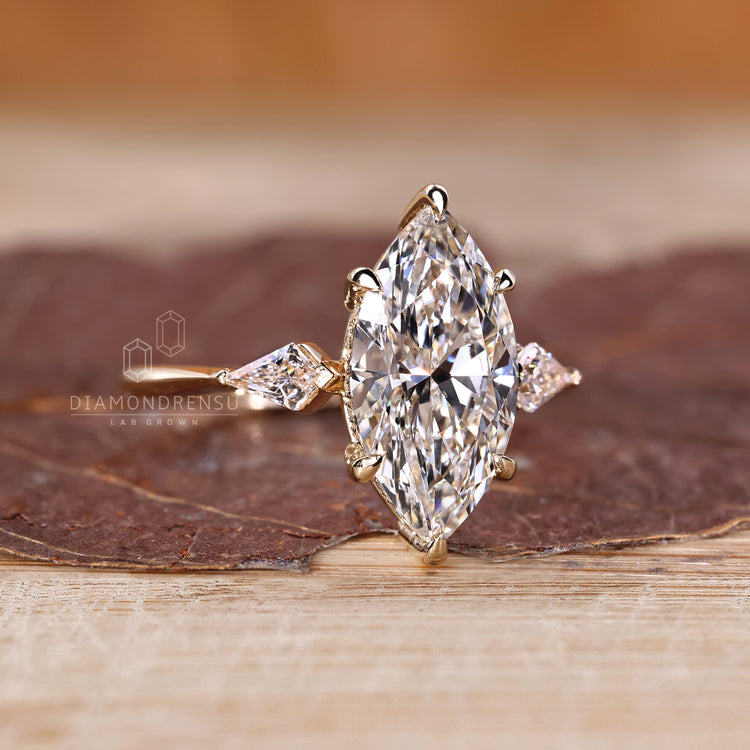 Tapered shank marquise diamond ring.