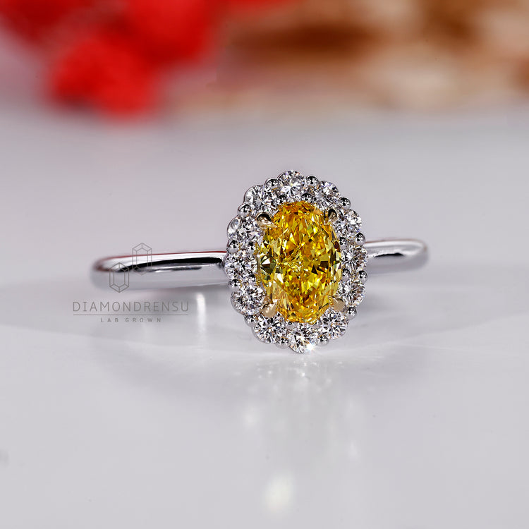 Cathedral setting ring with oval diamond and round side diamonds.