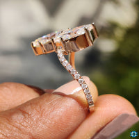 Round cut pave ring with shimmering side stones.