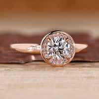 Diamondrensu engagement ring with halo diamond and 4 prong claw setting.