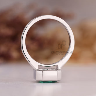 Handmade asscher cut emerald engagement ring.