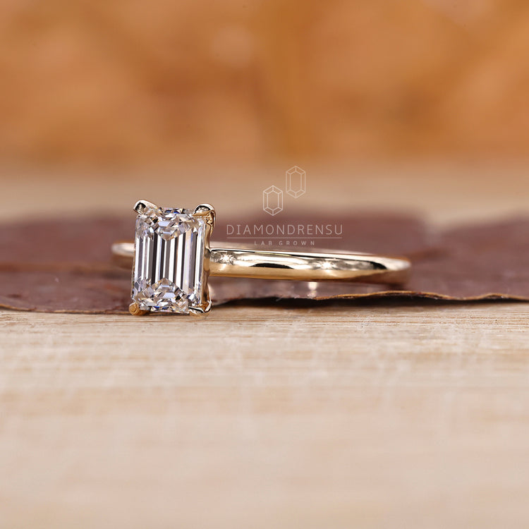 Cathedral setting ring with a raised diamond profile.
