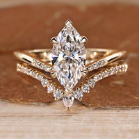 Marquise wedding ring with round cut pave style.