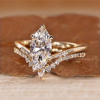 Upside down setting adds detail to the marquise wedding ring.