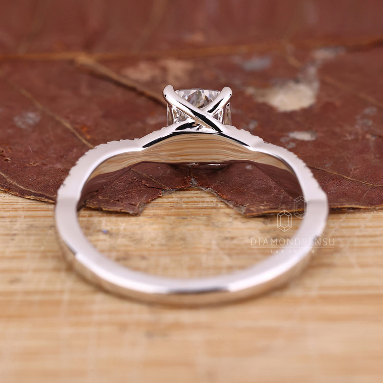 Handmade ring with twisted shank and sparkling round cut diamonds.