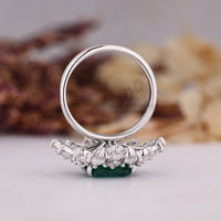 Tapered shank white gold emerald ring.