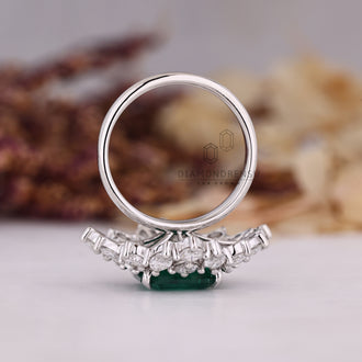 Tapered shank white gold emerald ring.