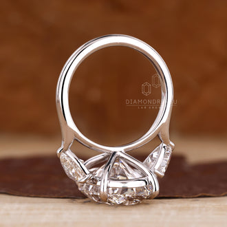 Lab grown diamond three stone engagement ring.