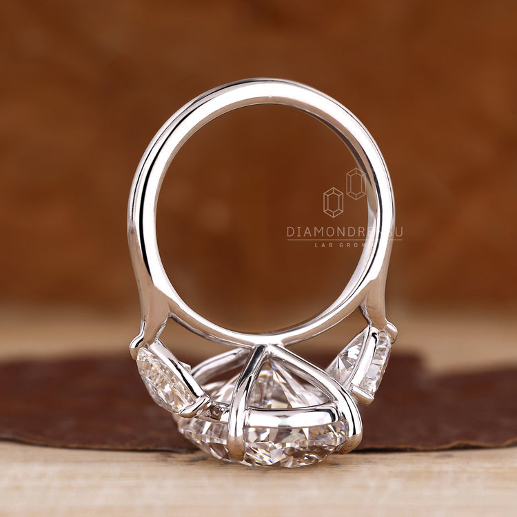 Lab grown diamond three stone engagement ring.