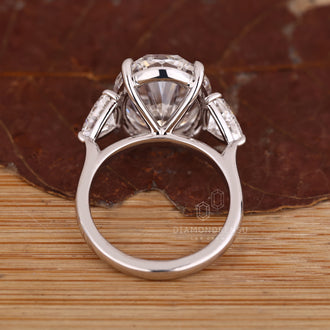 Handmade ring with oval and trillion diamonds.