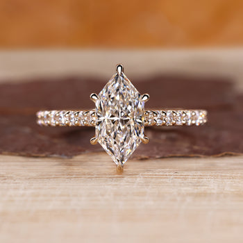 Dutch marquise engagement ring with pave setting and round cut pave band.