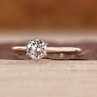Handmade diamond ring in cathedral solitaire style.