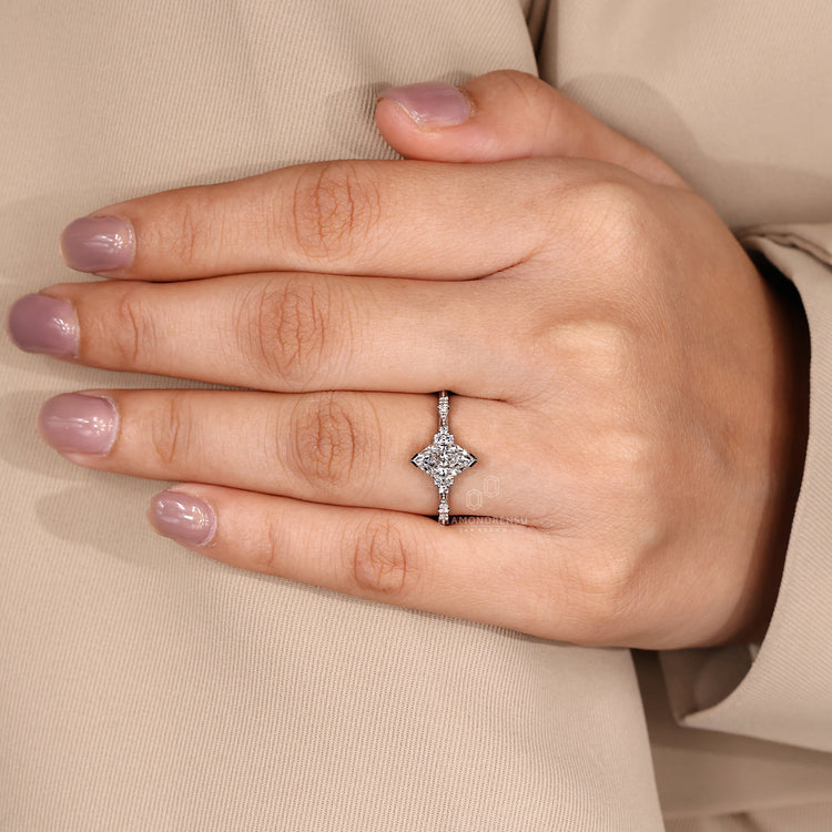 V shaped prong ring with marquise diamond and IGI certified stones.