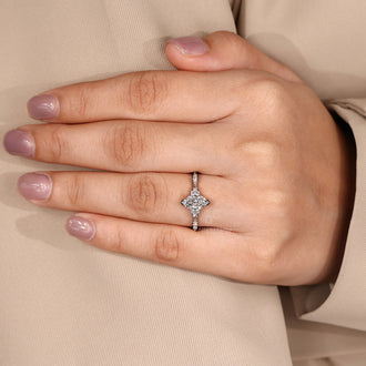 V shaped prong ring with marquise diamond and IGI certified stones.